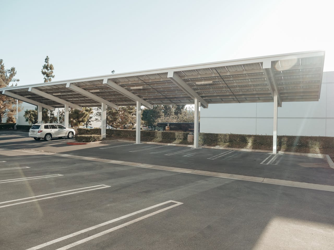 about-us Solar panels installed over a parking lot, showcasing clean energy innovation outdoors.